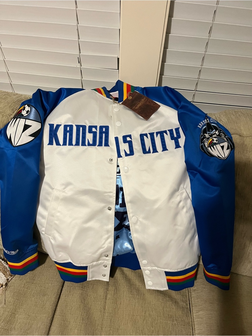 Mitchell & Ness White and Blue Kansas City Bomber Jacket with Rainbow Trim